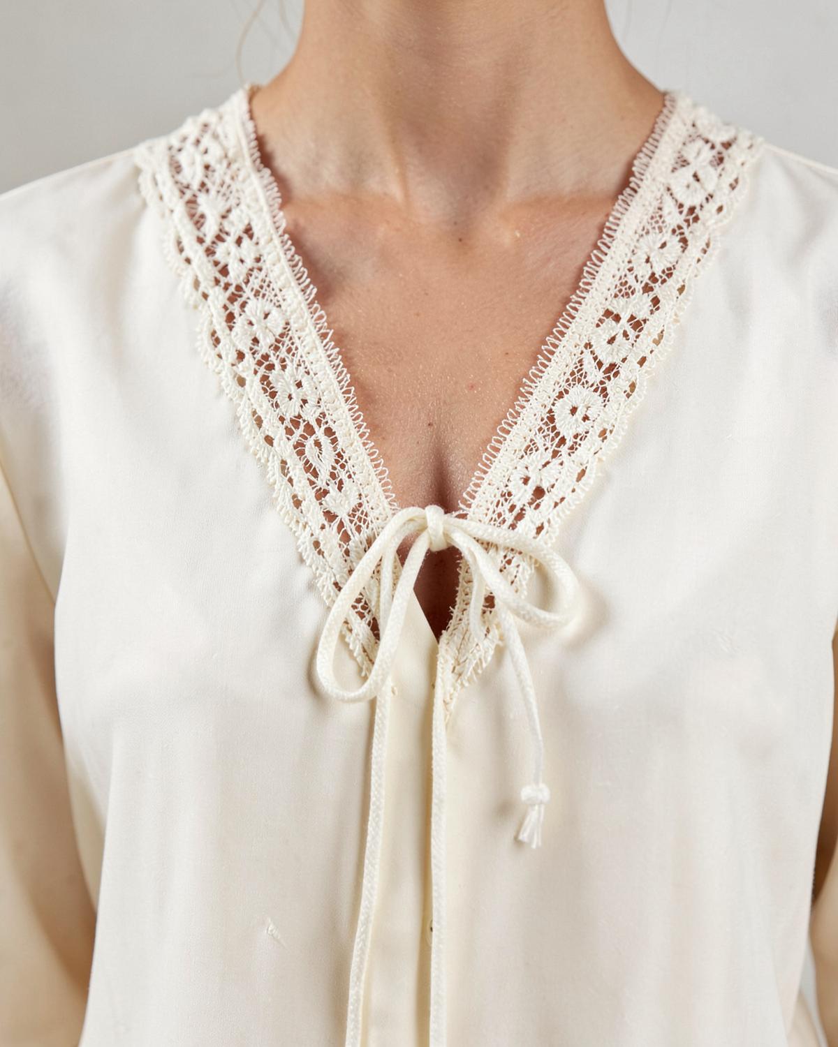 Ivory blouse neckline finished with broderie lace and cord ties